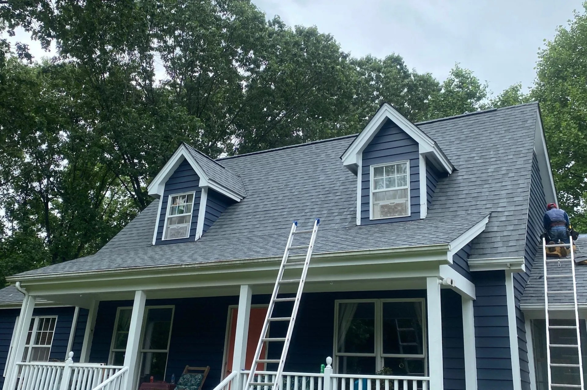 Gray shingle roof on blue home with dormers in Charleston, WV
