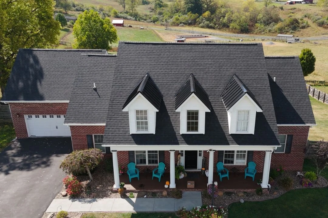 Dark shingle roof on brick home aerial view in Princeton, WV