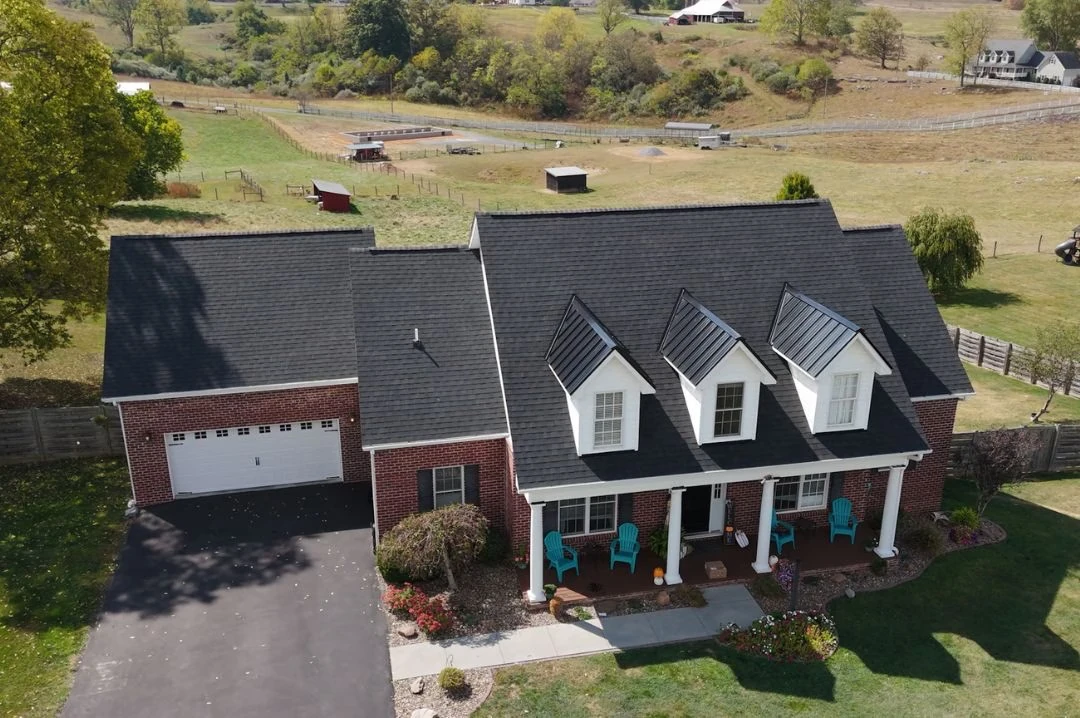 Dark shingle roof on brick home aerial view in South Charleston, WV