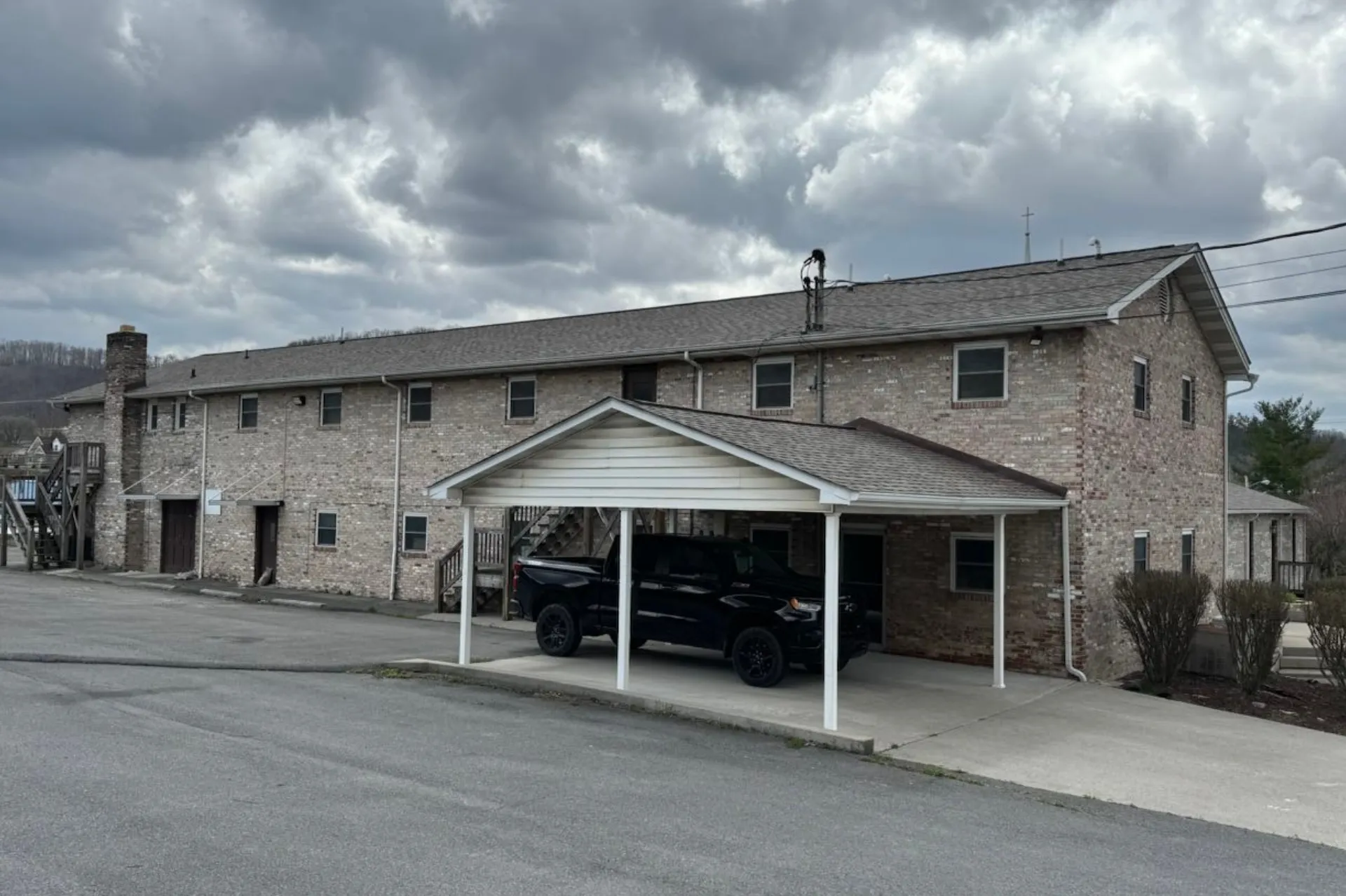 Gray shingle roof on brick multi-unit building in Beckley, WV