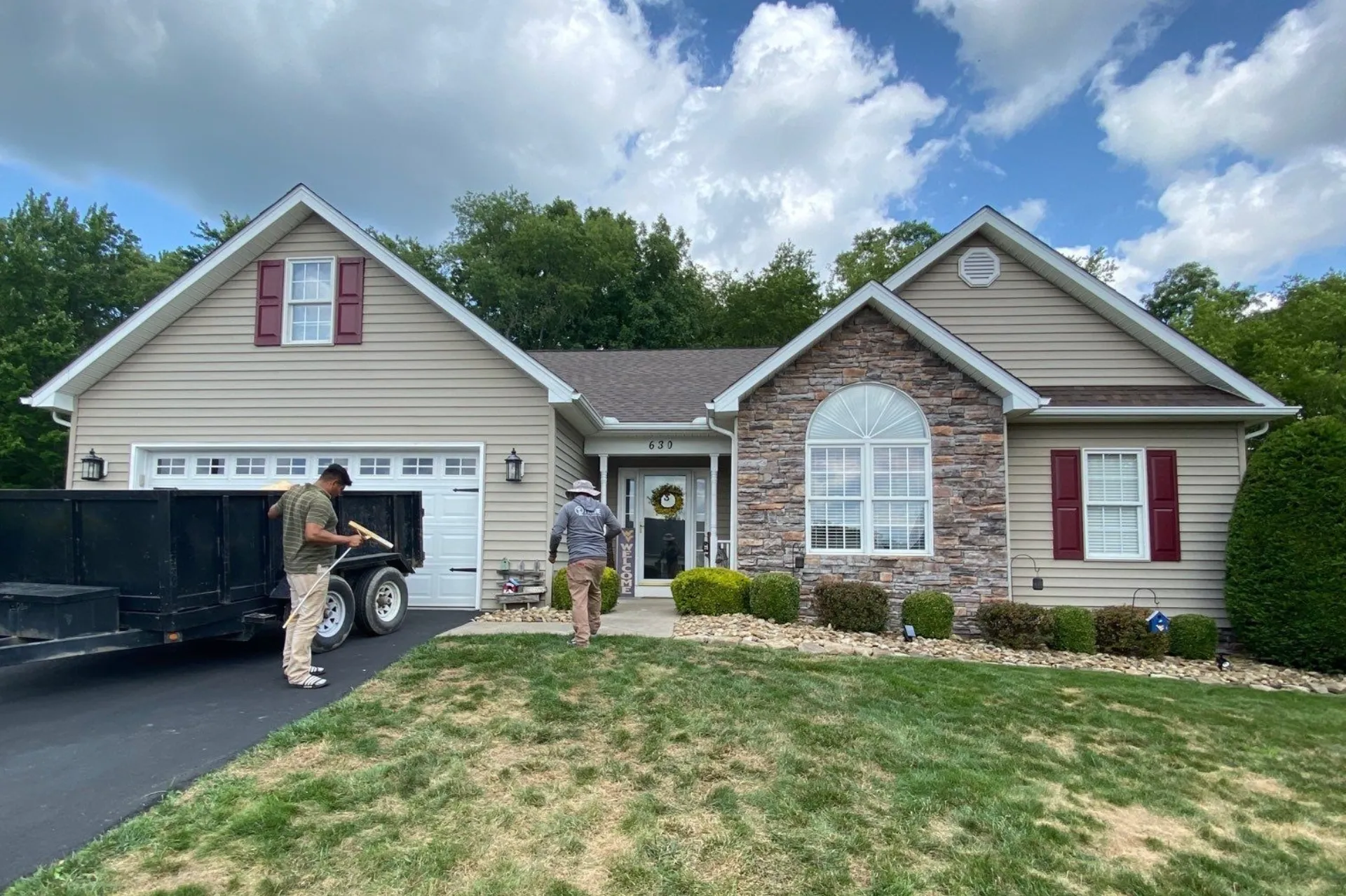 Brown shingle roof on tan home in Hinton, WV
