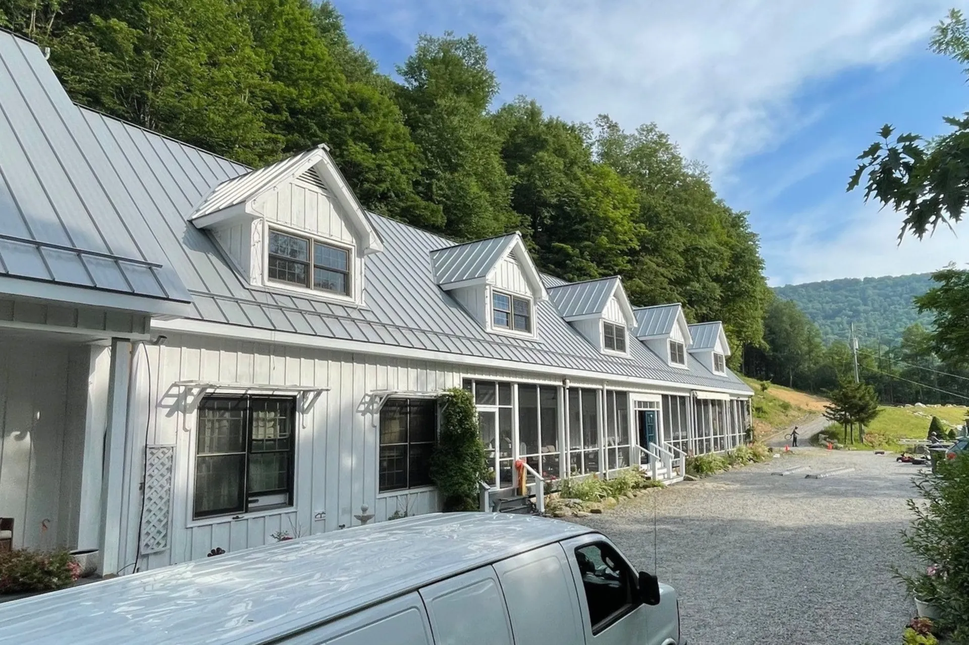 Standing seam metal roof on white building in Oak Hill, WV